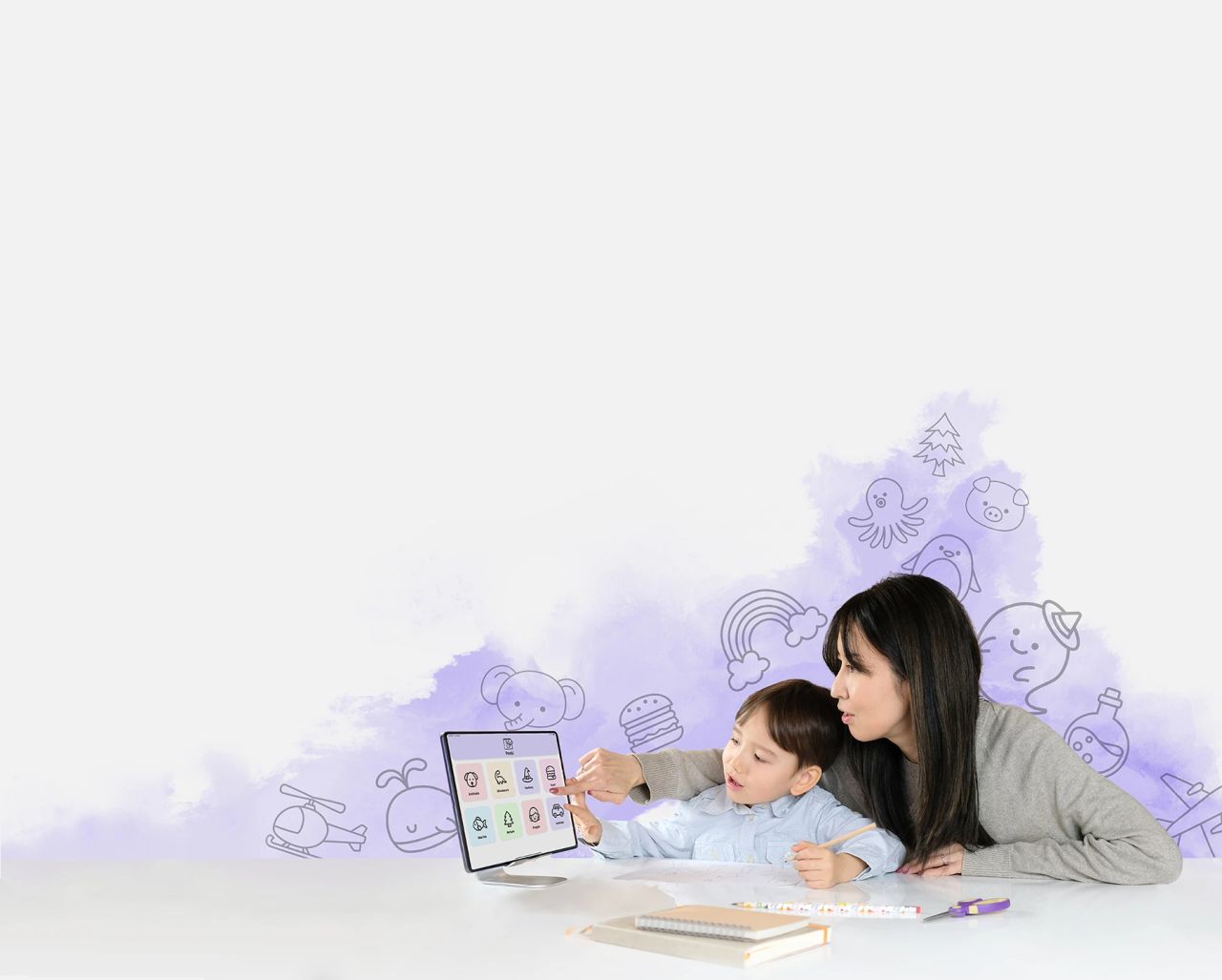mother with son learning to draw
